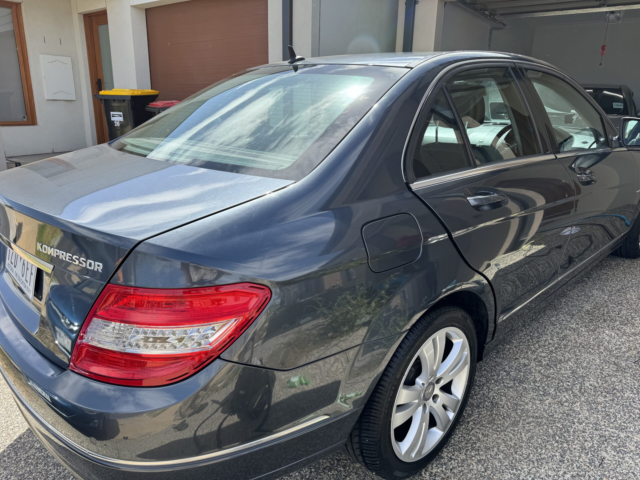 ceramic coating service in Truganina on black sedan scaled